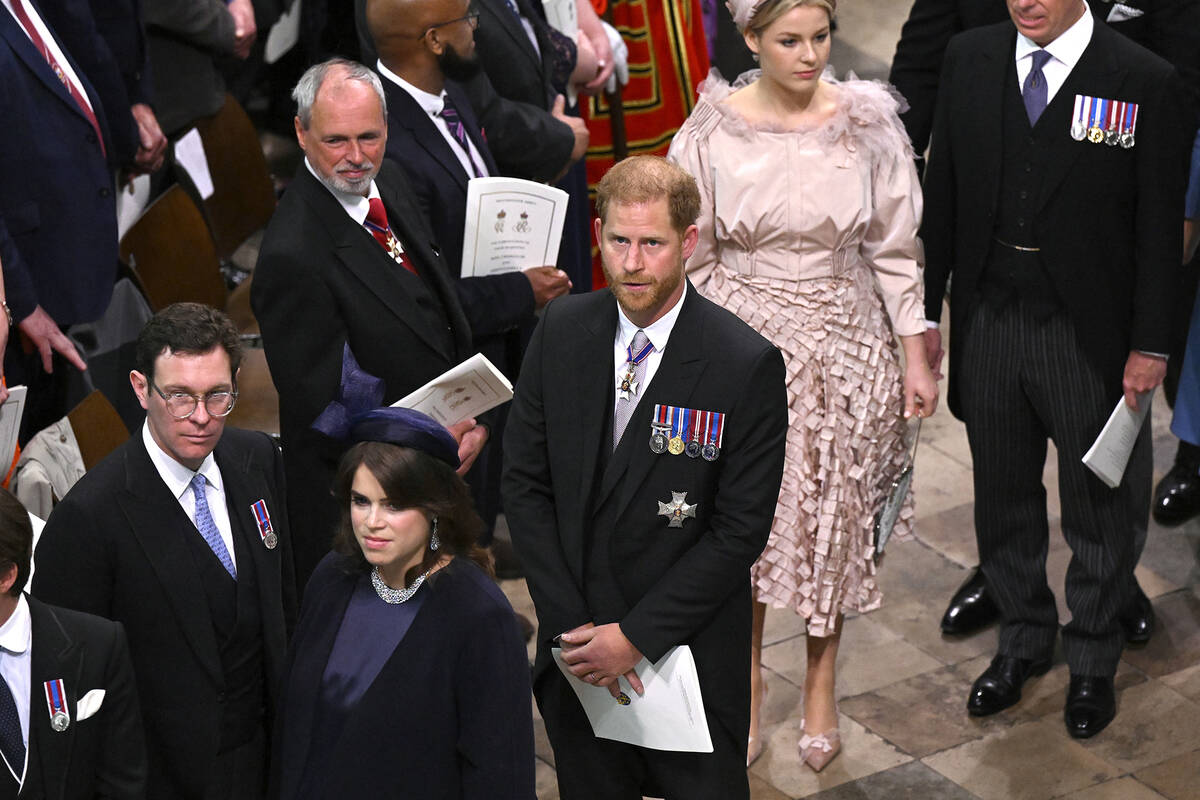 Prince Harry leaves Westminster Abbey after the coronation of King Charles III in London, Satur ...