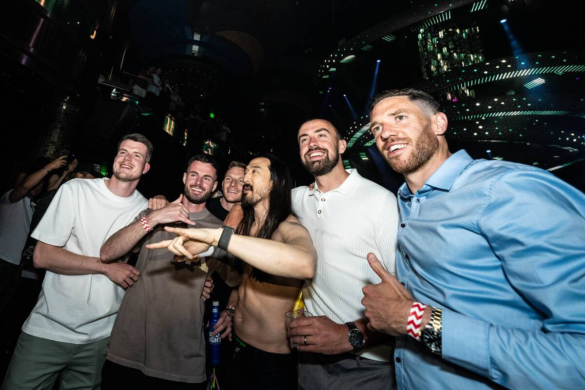 Members of the Wrexham soccer team are shown with superstar DJ Steve Aoki at Omnia Nightclub at ...