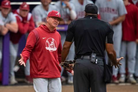 Alabama head coach Brad Bohannon, left, argues with umpire Joe Harris after being tossed from a ...