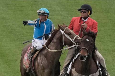 Javier Castellano celebrates after riding Mage to win the 149th running of the Kentucky Derby h ...