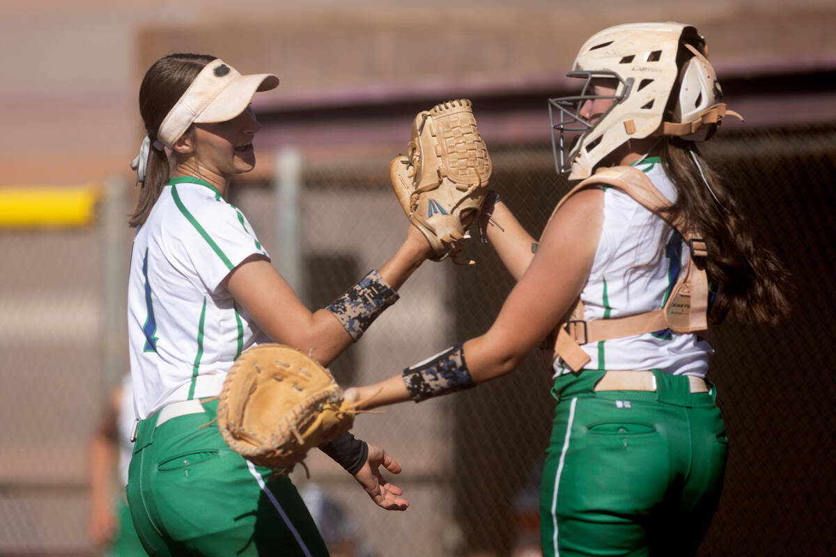 FILE - Green Valley pitcher Avari Morris, left, celebrates with catcher Rustie Riley after she ...