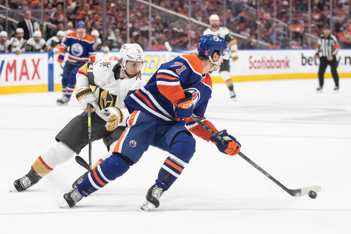 Vegas Golden Knights' William Karlsson (71) chases Edmonton Oilers' Ryan McLeod (71) during thi ...