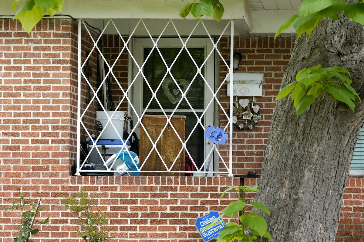 The front entrance of a home connected to suspected mall gunman, Mauricio Garcia, is seen, Sund ...