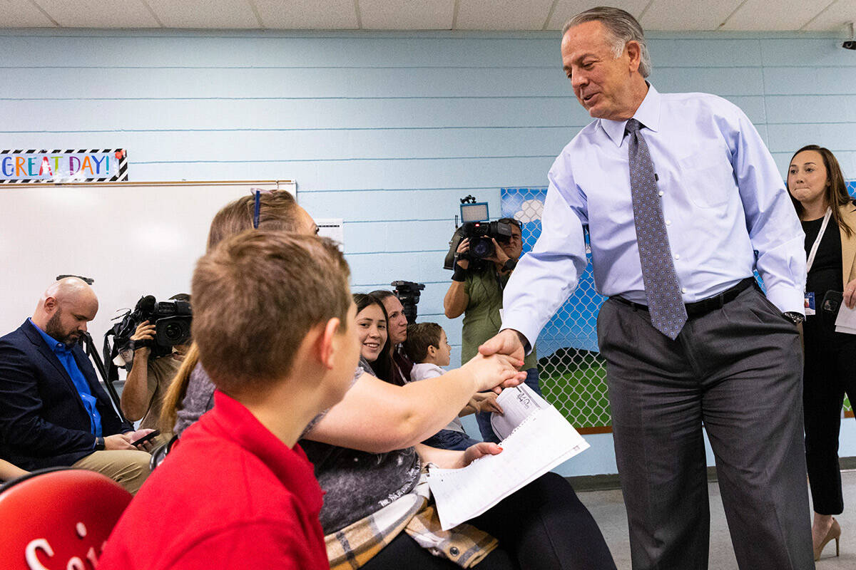 Gov. Joe Lombardo, shakes hands with students at Mountain View Christian School and their paren ...