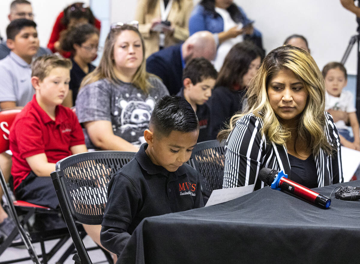 Roman Lomeli, a second-grade student at Mountain View Christian School, reads his testimony as ...