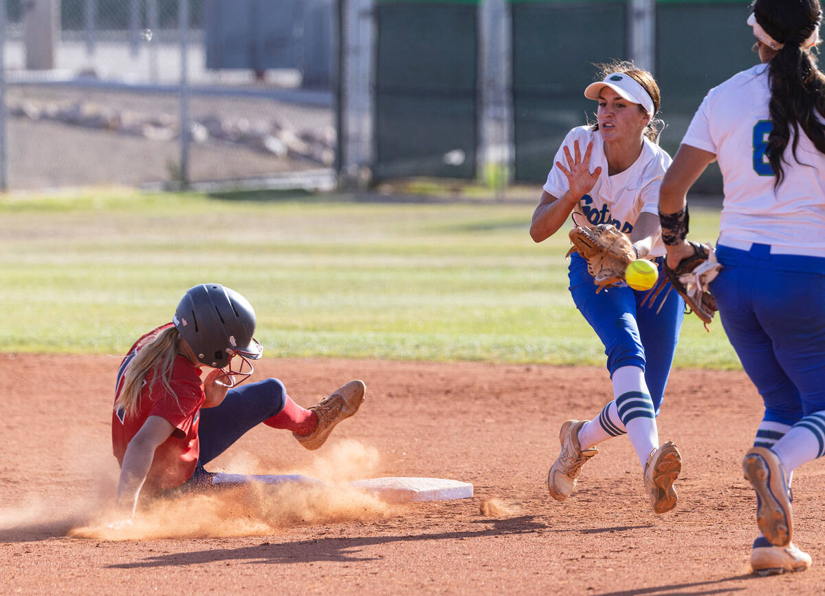 Liberty High's Jesse Farrell (17) slides safe at second as Green Valley High's Mikee Morris (1 ...