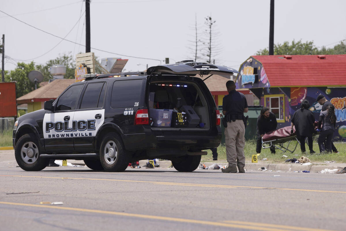 Emergency personnel respond to a fatal collision in Brownsville, Texas, on Sunday, May 7, 2023. ...