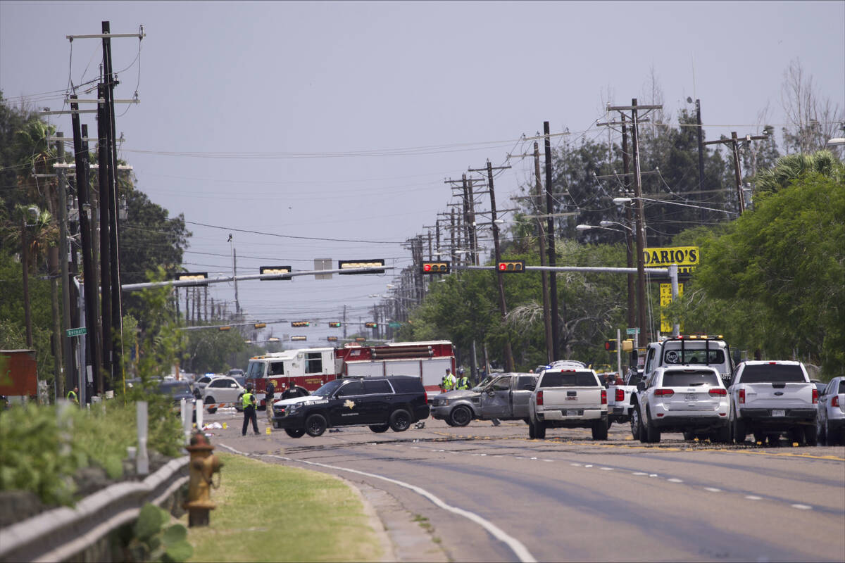 Emergency personnel respond to a fatal collision in Brownsville, Texas, Sunday, May 7, 2023. Se ...