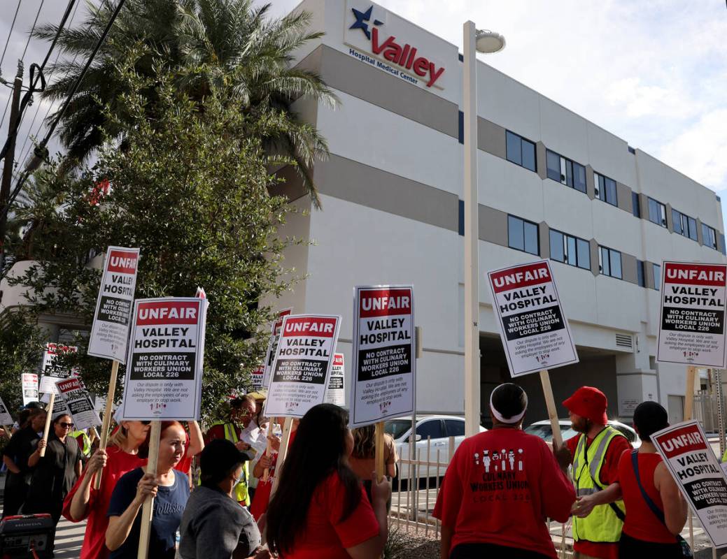 Members of the Culinary Union picket Valley Hospital Medical Center in Las Vegas in August 2022 ...