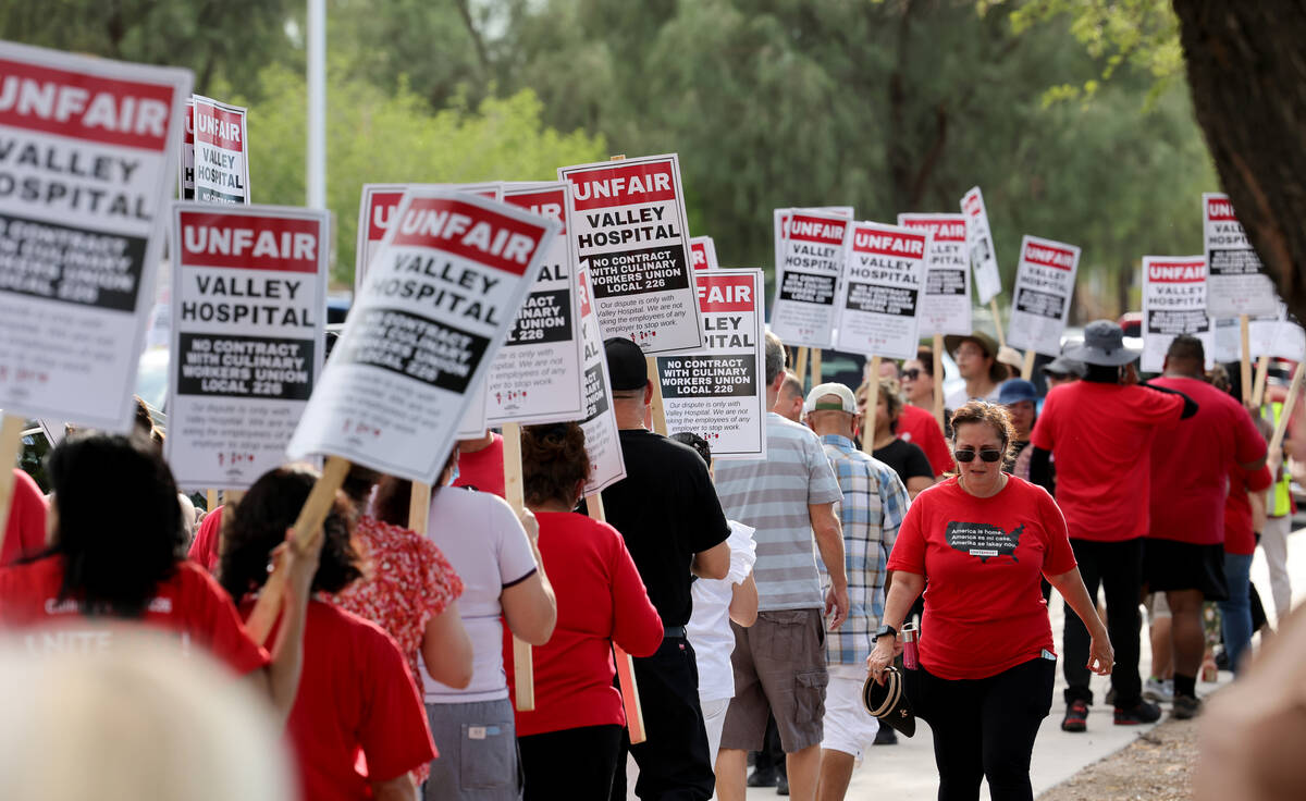 Members of the Culinary Union picket Valley Hospital Medical Center in Las Vegas in August 2022 ...