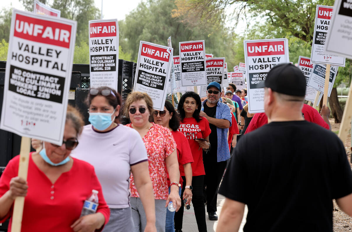 Members of the Culinary Union picket Valley Hospital Medical Center in Las Vegas in August 2022 ...