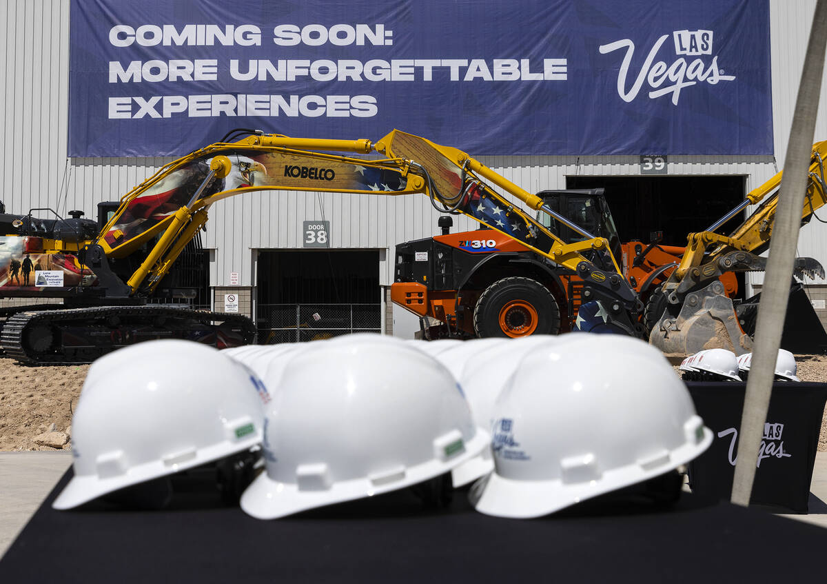 Heavy construction equipments are seen where the stage is set for a ceremonial groundbreaking o ...