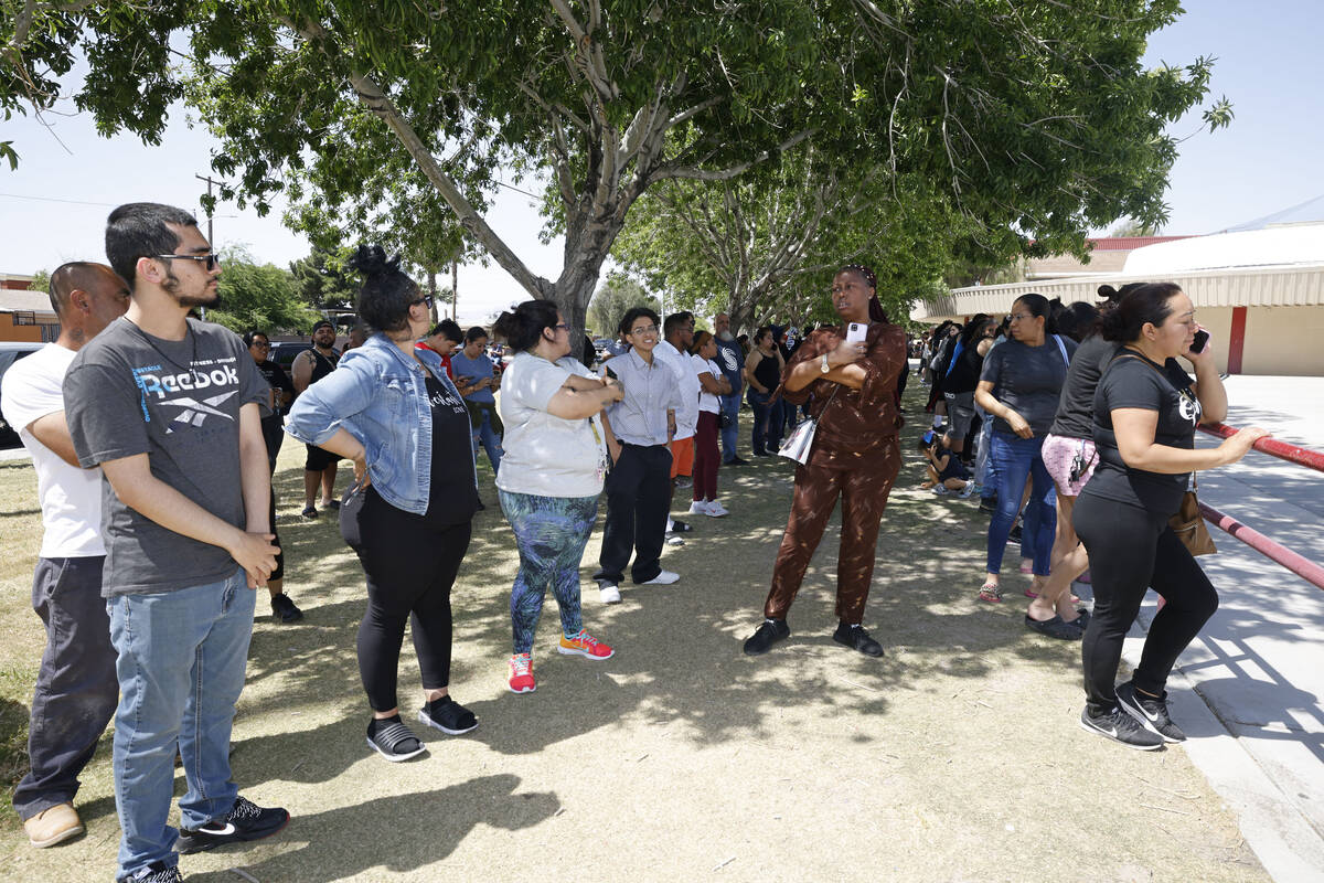 People gather outside Ed Von Tobel Middle School, Monday, May 8, 2023, in Las Vegas, during a l ...