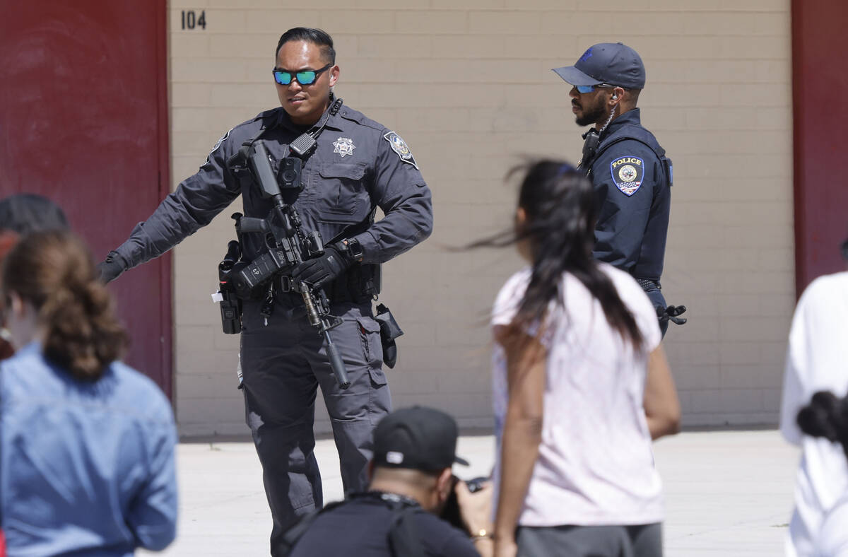 Officers direct people outside Ed Von Tobel Middle School, Monday, May 8, 2023, in Las Vegas, d ...