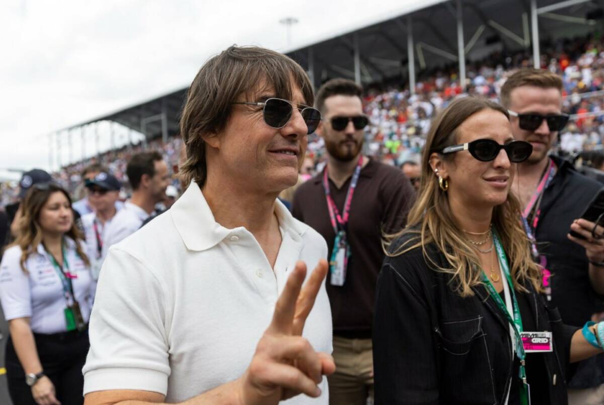 Actor Tom Cruise walks along the grid before the start of the Formula One Miami Grand Prix at ...