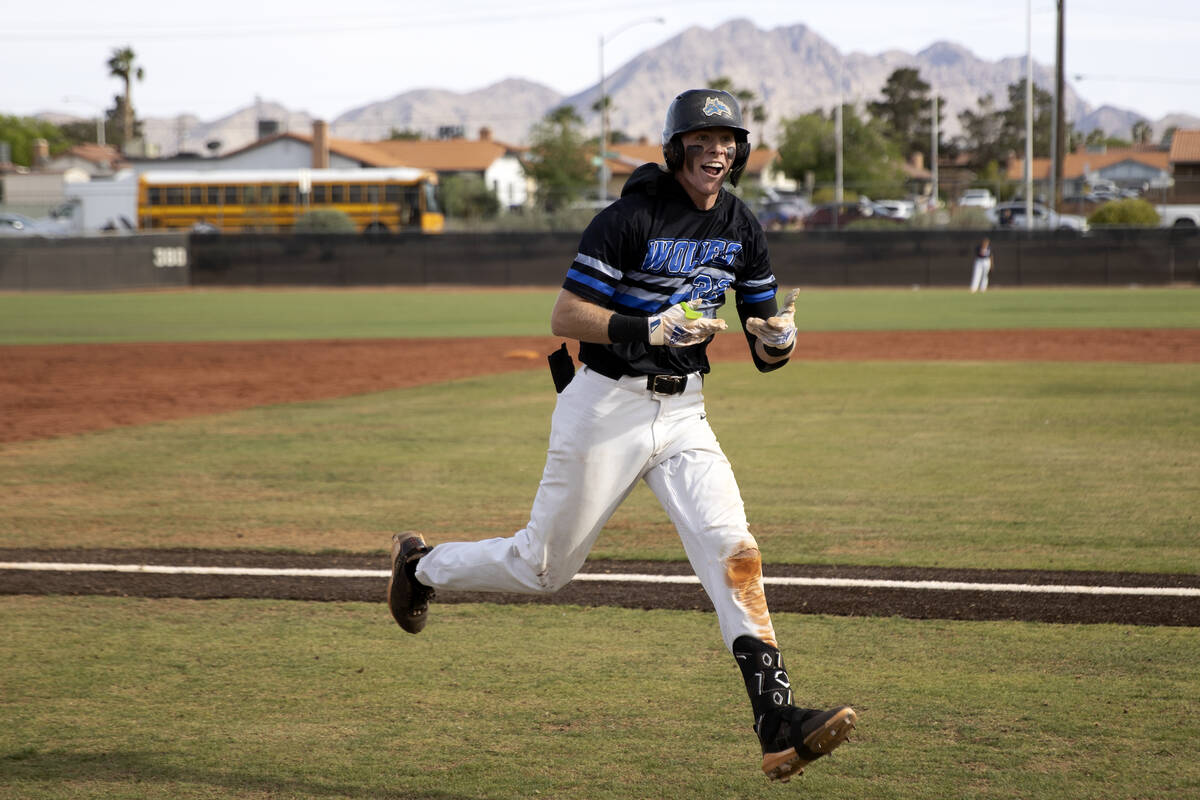 Basic’s Andruw Giles celebrates after hitting a homer during a high school Class 5A Sout ...