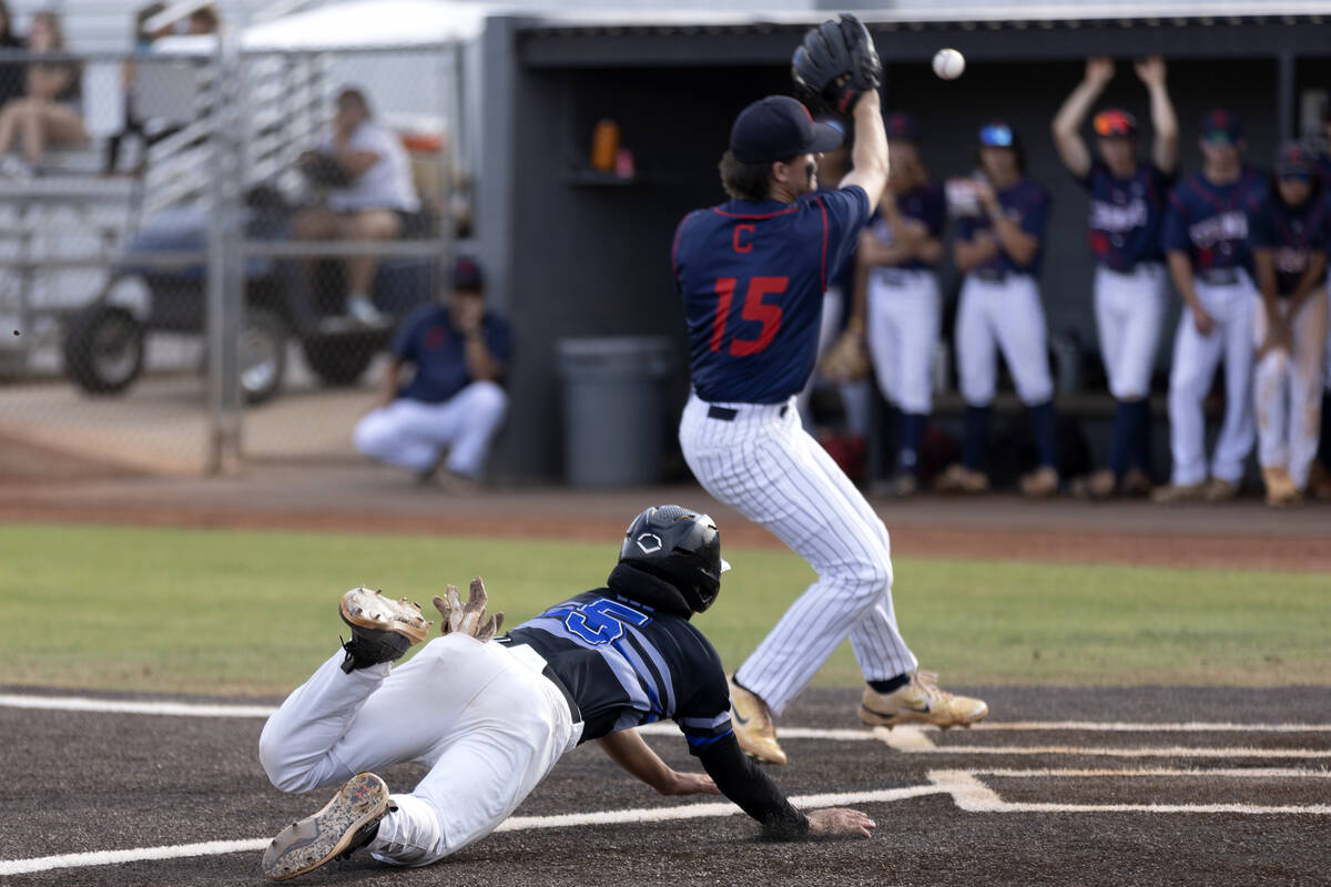 Basic’s Lyndon Lee (5) slides into home plate while Coronado’s AJ Victoravich (15 ...