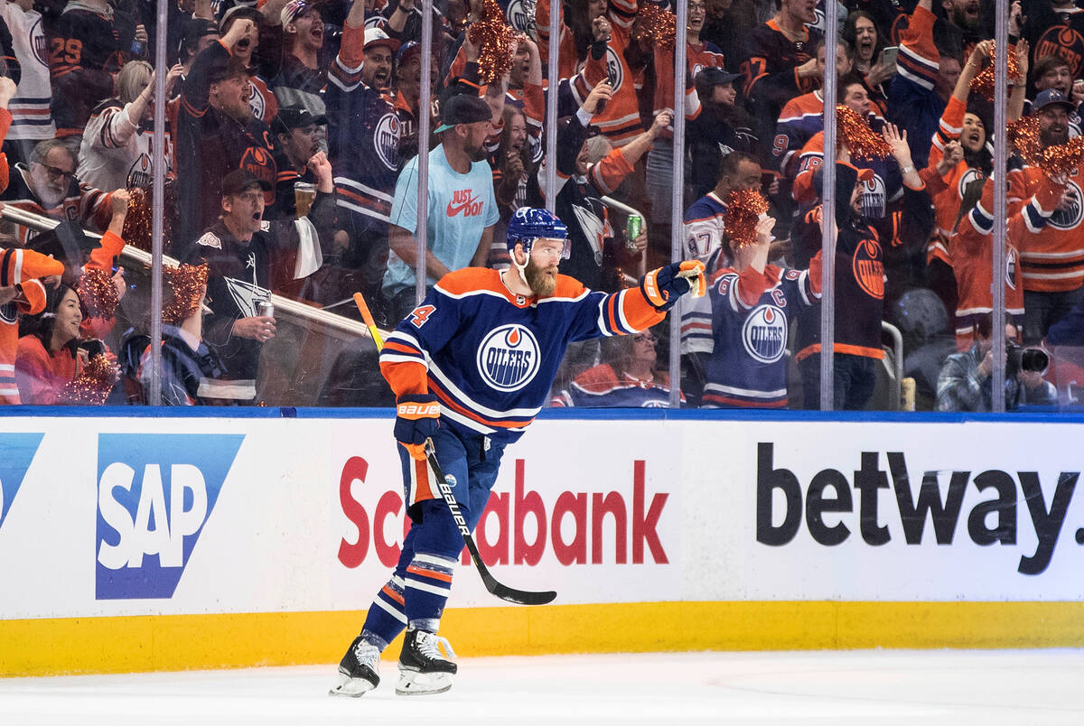 Edmonton Oilers' Mattias Ekholm (14) celebrates a goal against the Vegas Golden Knights during ...