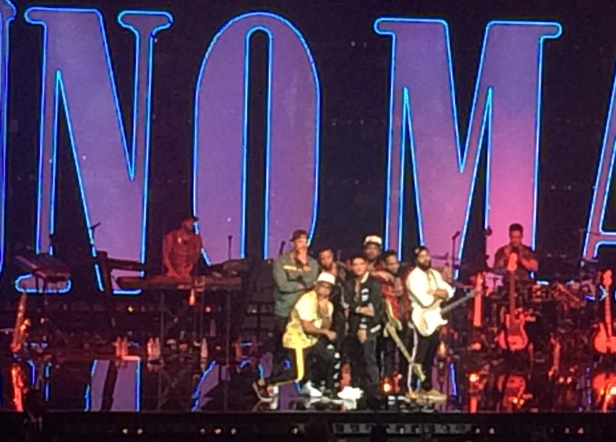 Bruno Mars and his band put up the house lights to allow all 5,185 people to snap a photo, Satu ...