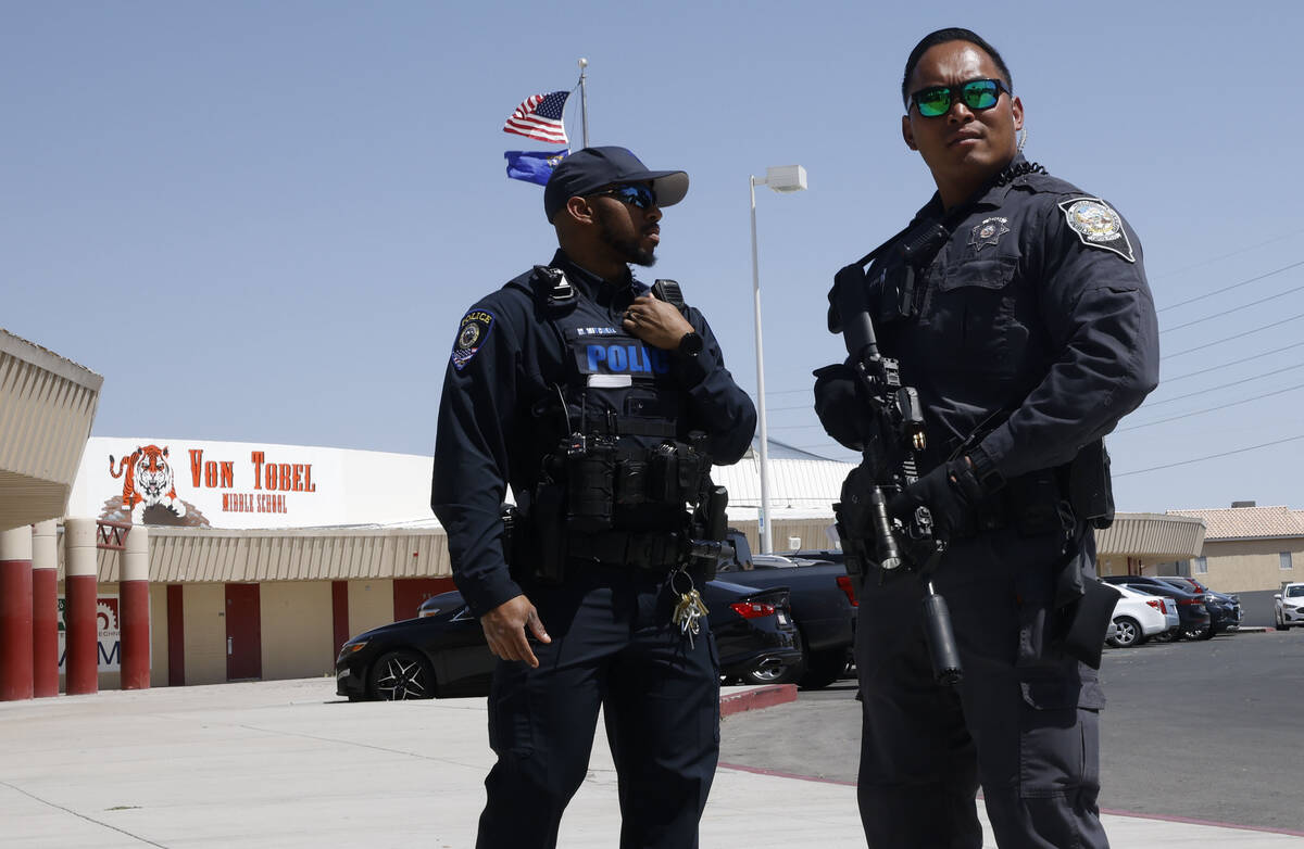 Officers stand in front of Von Tobel Middle School on Monday, May 8, 2023, in Las Vegas, after ...
