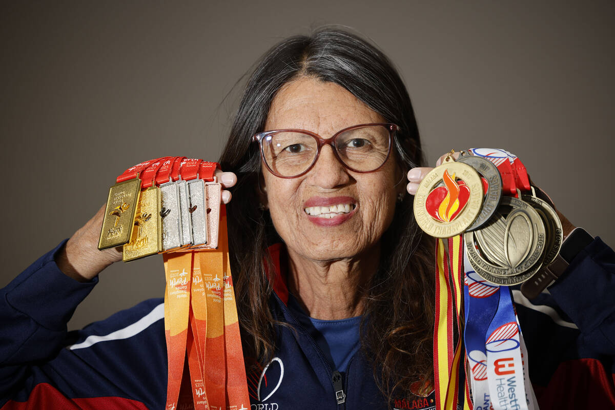 Dinorah Arambula, who had a successful kidney transplant in 2011, holds her medals for the Worl ...