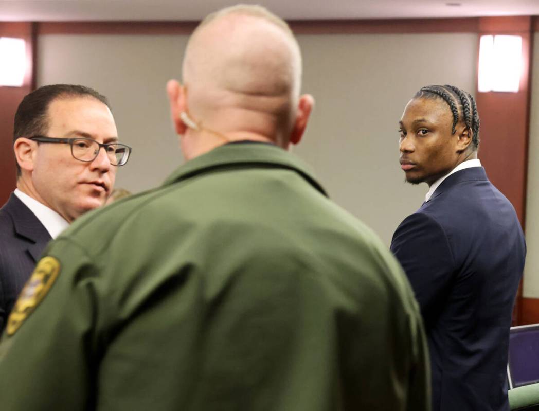 Former Raiders player Henry Ruggs, right, appears in court at the Regional Justice Center in La ...