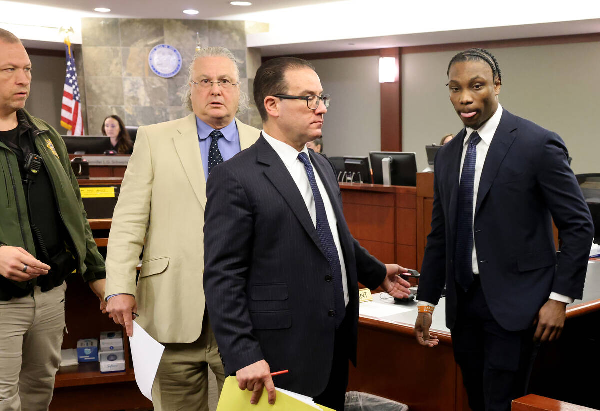 Former Raiders player Henry Ruggs, right, leaves the courtroom on Wednesday, May 11, 2023, afte ...