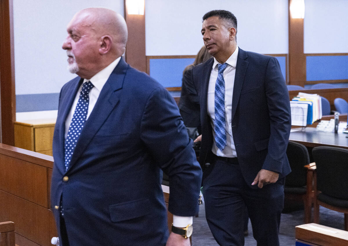 Former Alpine Motel Apartments owner Adolfo Orozco, right, leaves the courtroom with his attorn ...