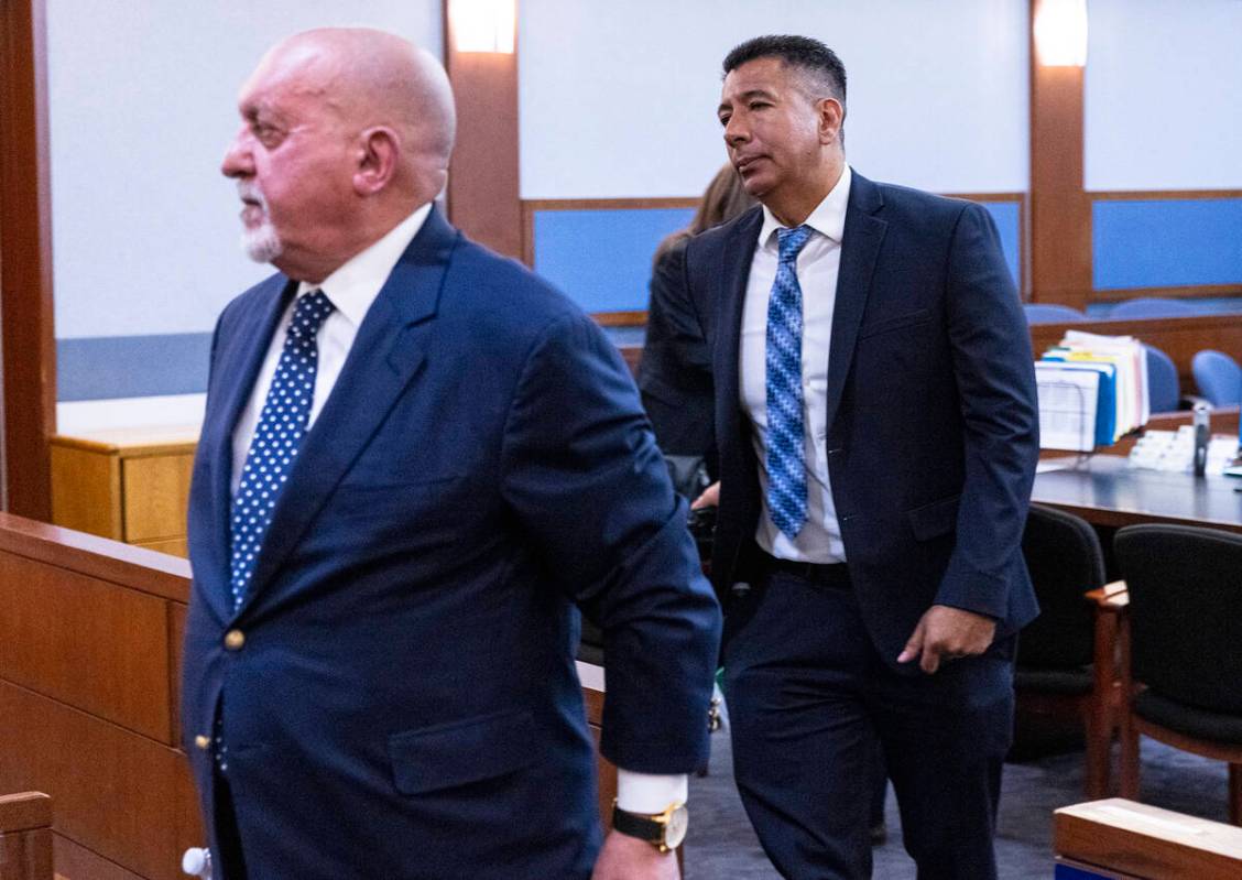 Former Alpine Motel Apartments owner Adolfo Orozco, right, leaves the courtroom with his attorn ...