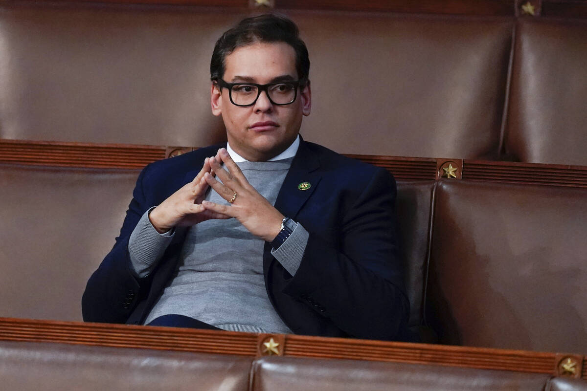 FILE - Rep. George Santos, R-N.Y., waits for the start of a session in the House chamber as the ...