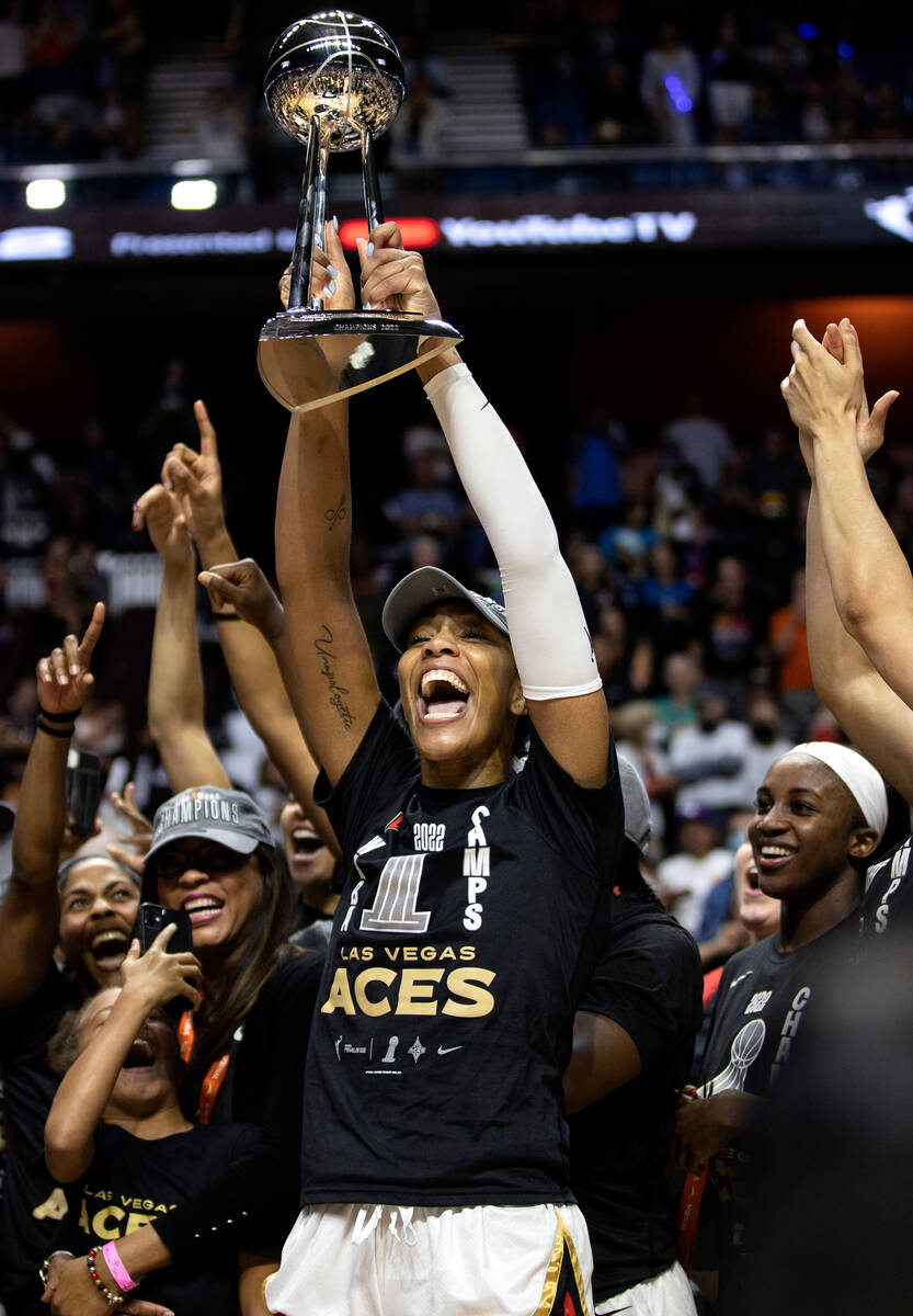 Las Vegas Aces forward A'ja Wilson (22), the 2022 WNBA MVP, holds up the WNBA Championship trop ...
