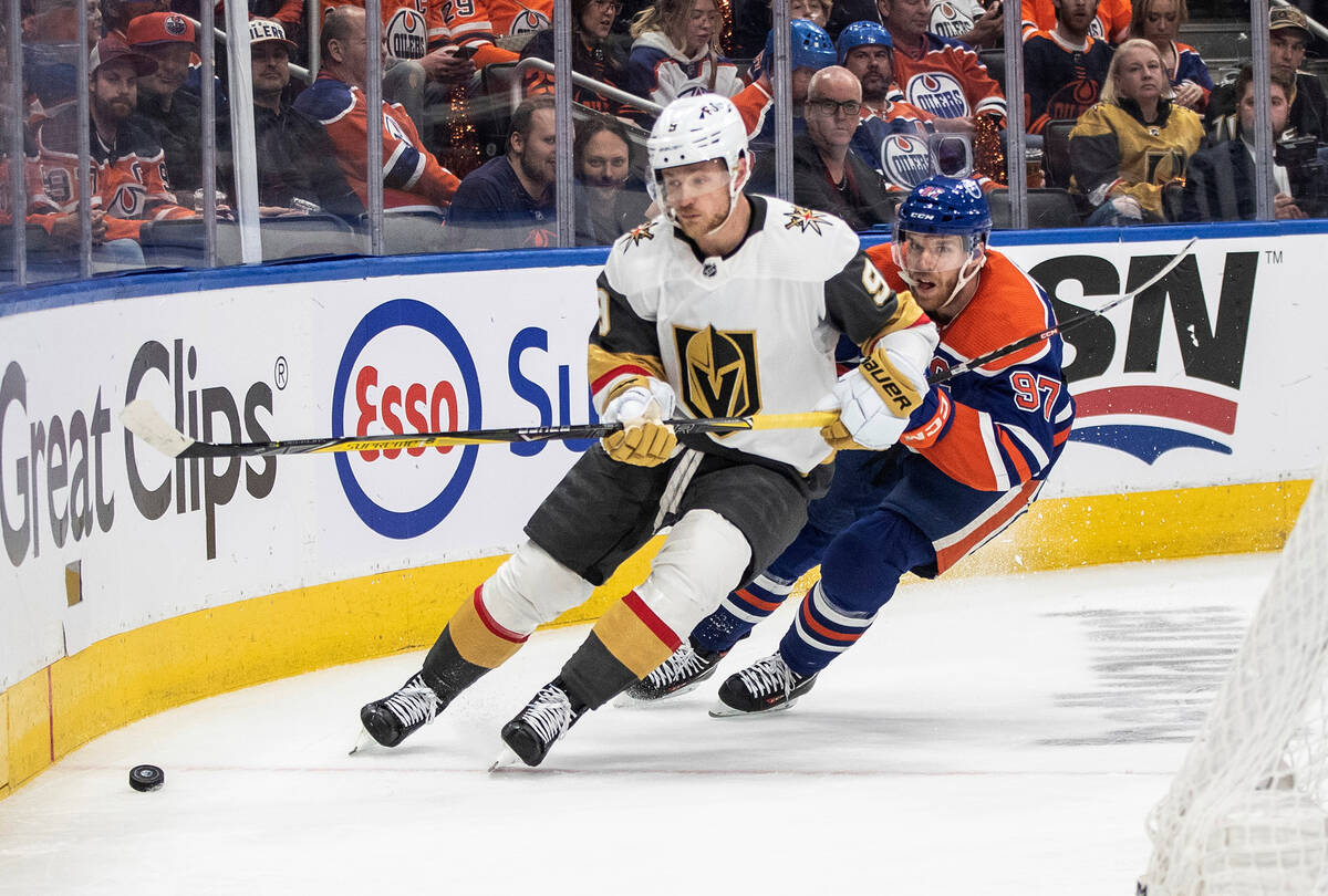 Vegas Golden Knights Jack Eichel (9) is chased by Edmonton Oilers' Connor McDavid (97) during t ...