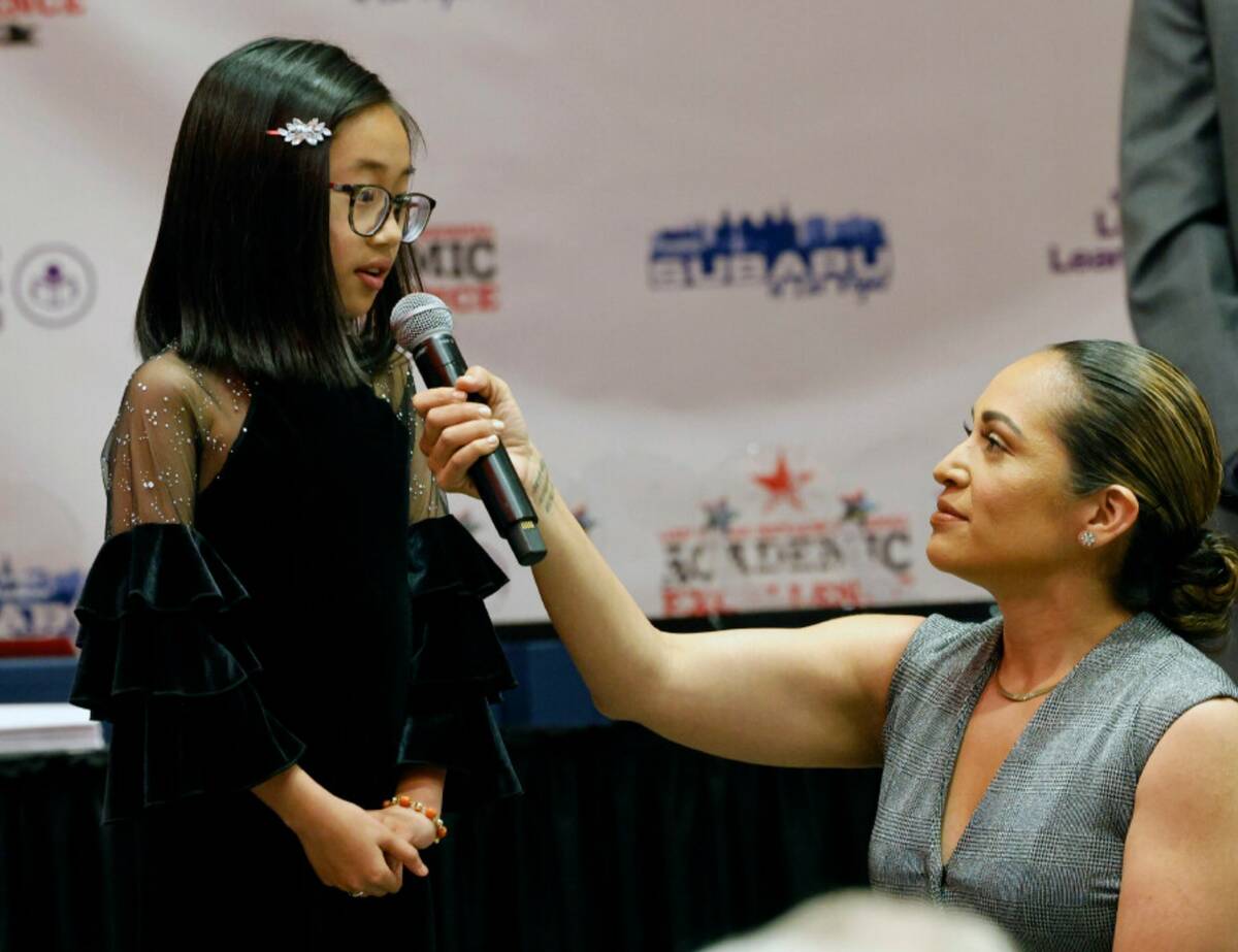 Brianna Ong, fourth grader of Legacy Traditional School speaks to Carrie Roper, Las Vegas Revie ...