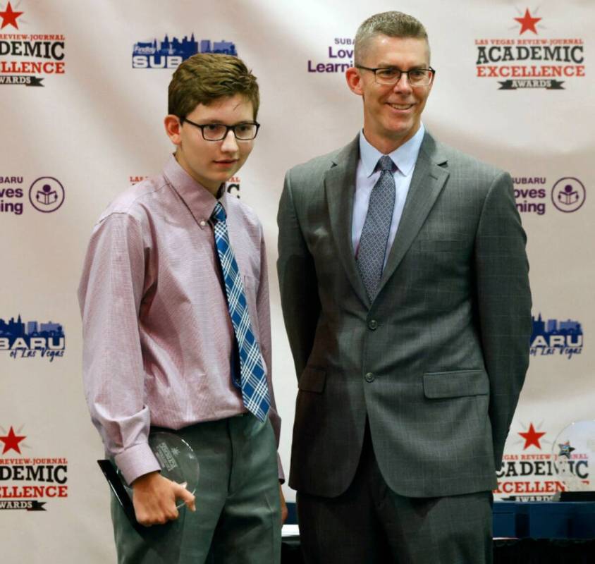 Sawyer VanZanten, 10th grader of Cimarron Memorial High School, poses for a photo with Glenn Co ...