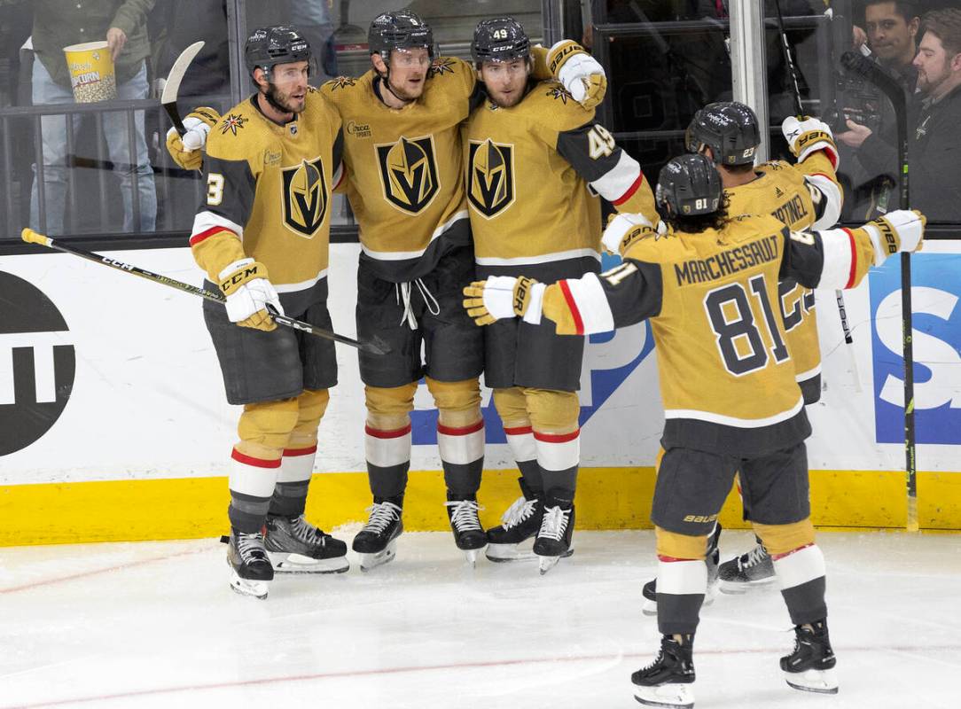 The Golden Knights celebrate after Golden Knights center Jack Eichel (9) scored during the firs ...