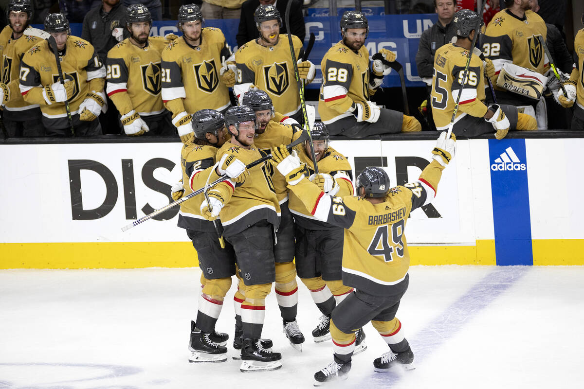 The Golden Knights celebrate after defenseman Nicolas Hague (14) scored during the second perio ...