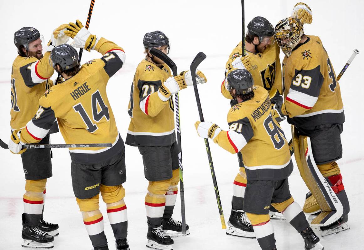 The Golden Knights line up to congratulate goaltender Adin Hill (33) after they won Game 5 of a ...