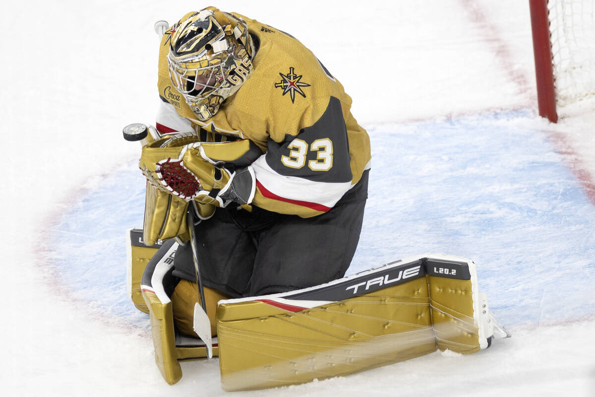 Golden Knights goaltender Adin Hill (33) saves the puck during the third period in Game 5 of an ...