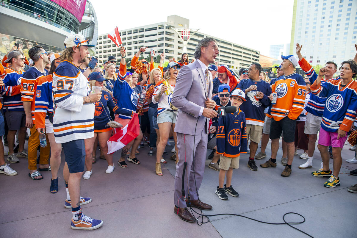 Sports Net Edmonton reporter Gene Principe is surrounded by fans outside before facing the Gold ...