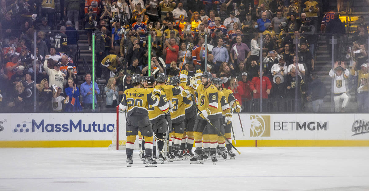 Golden Knights players celebrate their 4-3 win over the Edmonton Oilers following the third per ...