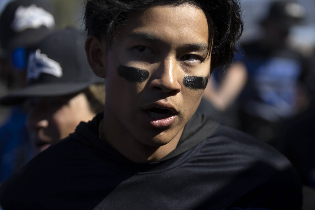 Basic’s Ty Southisene walks through a group of celebrating teammates after hitting a hom ...
