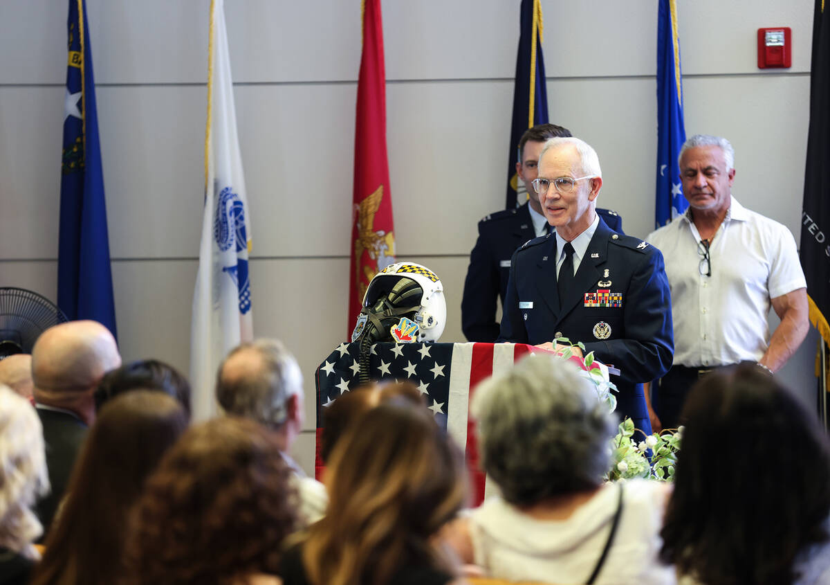 Retired Air Force member Bruce Fischer speaks about the life of Air Force Col. James Abraham at ...