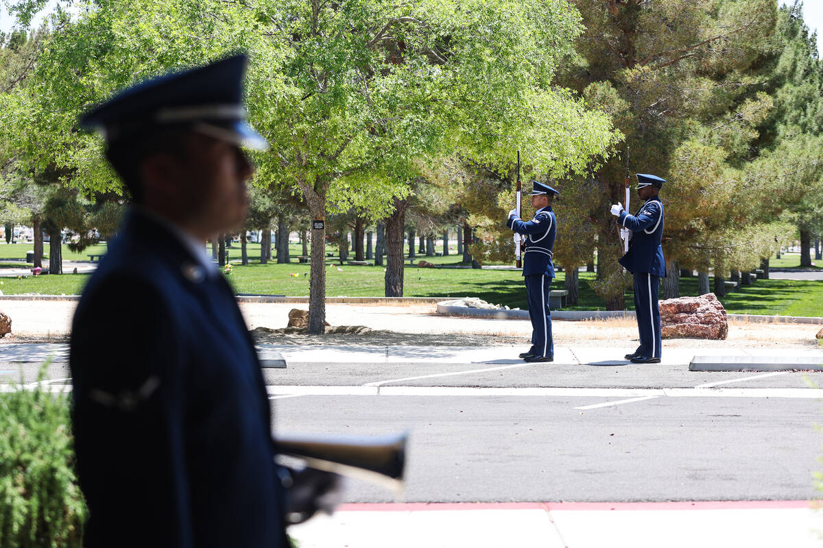 Air Force members perform the three-volley salute at the funeral of Col. James Abraham at the S ...