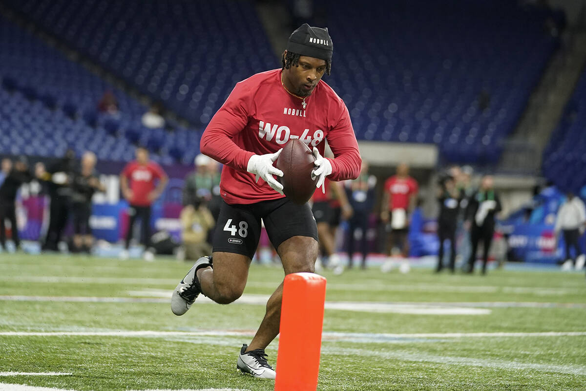 Cincinnati wide receiver Tre Tucker runs a drill at the NFL football scouting combine in Indian ...