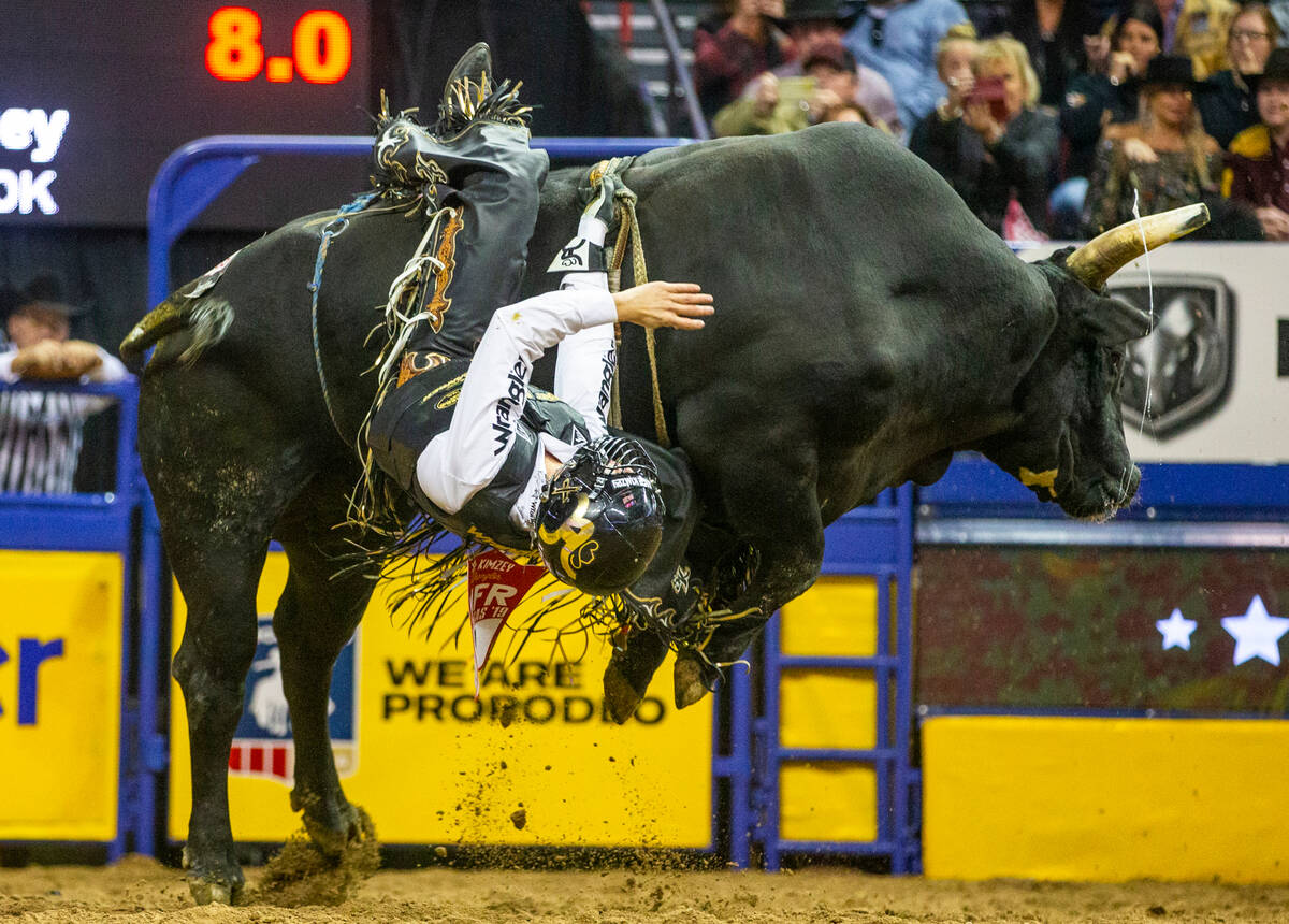 Sage Kimzey of Strong City, Okla, rides River Monster during the National Finals Rodeo at the T ...