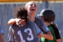 Centennial players, including pitcher Teagan Clemmons, right, and Keana Bell (13) celebrate bea ...