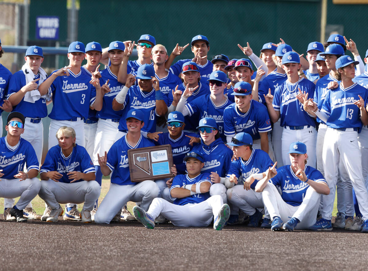 Bishop Gorman High School players pose for a victory photo after defeating Desert Oasis High 10 ...