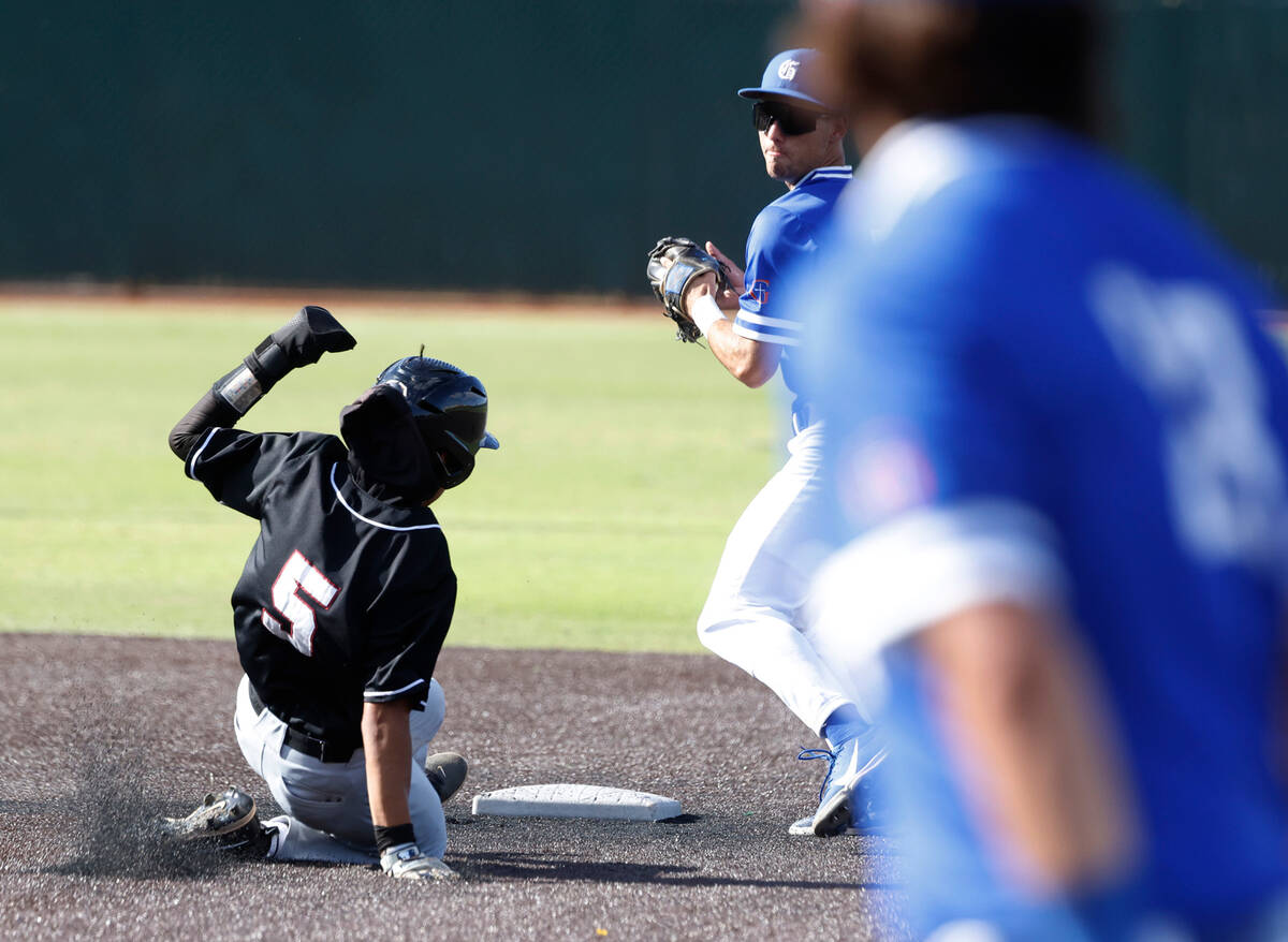 Desert Oasis High's Jet Gilliam (5) forced out at second by Bishop Gorman High's Maddox Riske ( ...