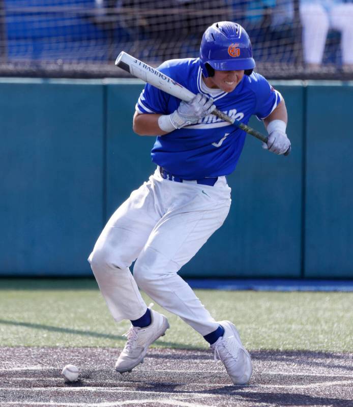 Bishop Gorman High's Burke Mabeus reacts after being hit by a pitch during the high school base ...