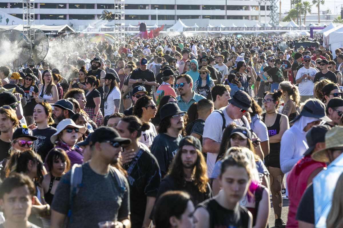 Attendees walk between the four stages during the Sick New World festival at the Las Vegas Fest ...